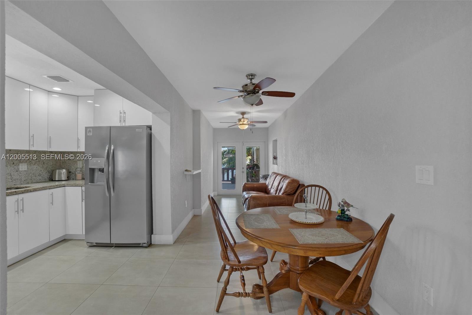 862 West 79th Street Hialeah, FL 33014 - Photo 9 of 34 a view of a dining room with furniture and chandelier