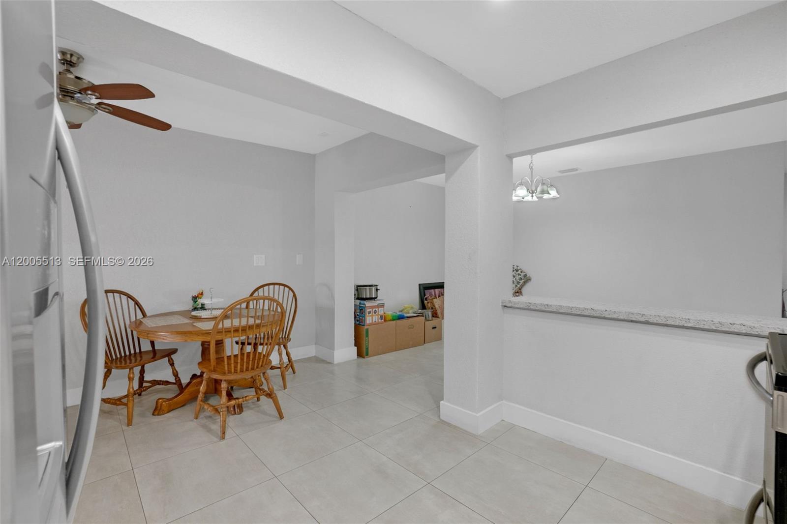 862 West 79th Street Hialeah, FL 33014 - Photo 10 of 34 a dining room with furniture and wooden floor