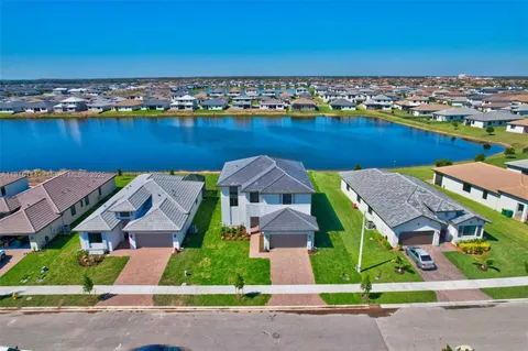 an aerial view of a house with a ocean view