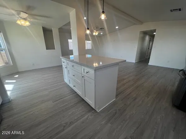 a kitchen with stainless steel appliances a refrigerator sink and microwave