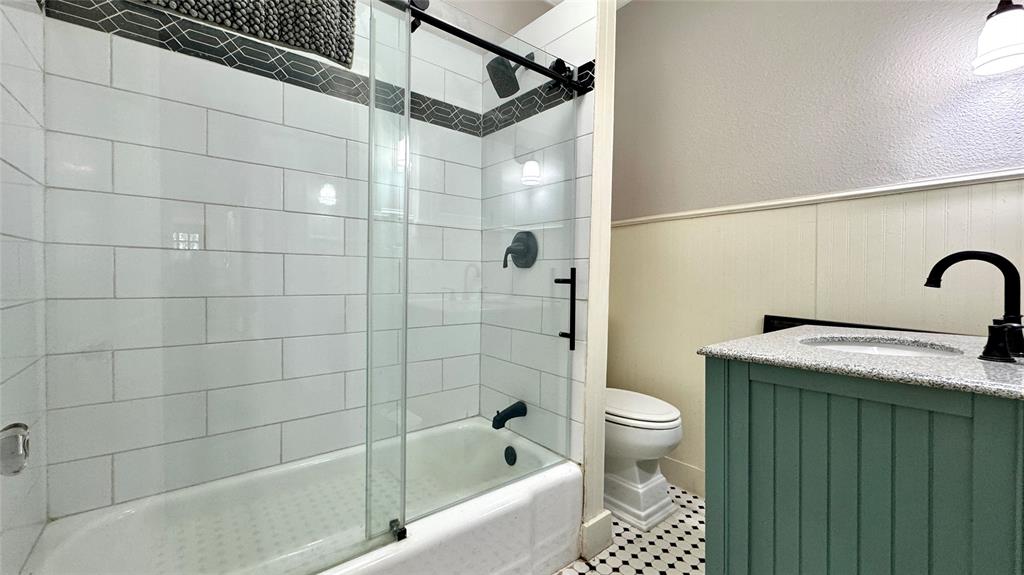 205 Elm Drive Terrell, TX 75160 - Photo 18 of 33 a bathroom with a sink a toilet and shower