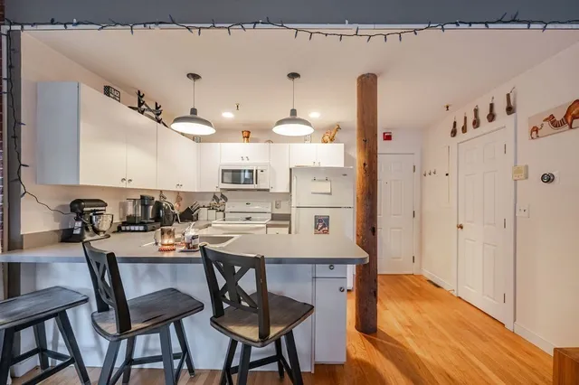 a living room with furniture and white walls