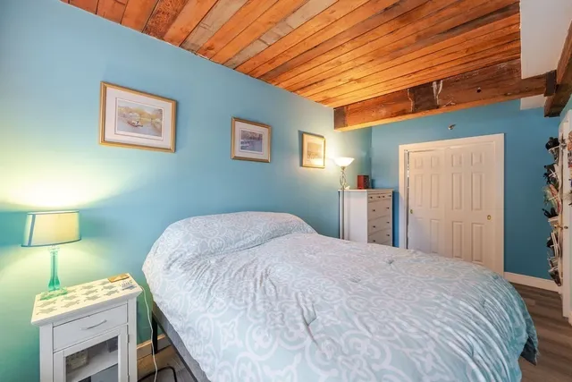 a view of a bedroom with closet and cabinet