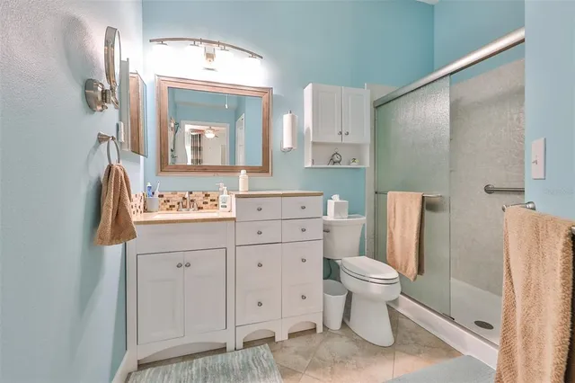 a living room with furniture a dining table and a window