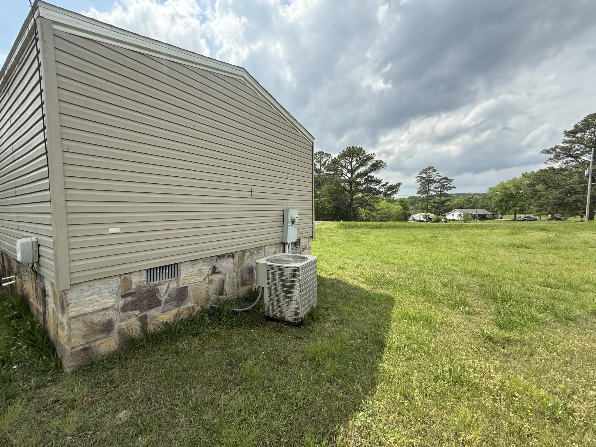 1001 Old Three Notch Road Ringgold, GA 30736 - Photo 24 of 26 a view of a backyard with chair and fire pit