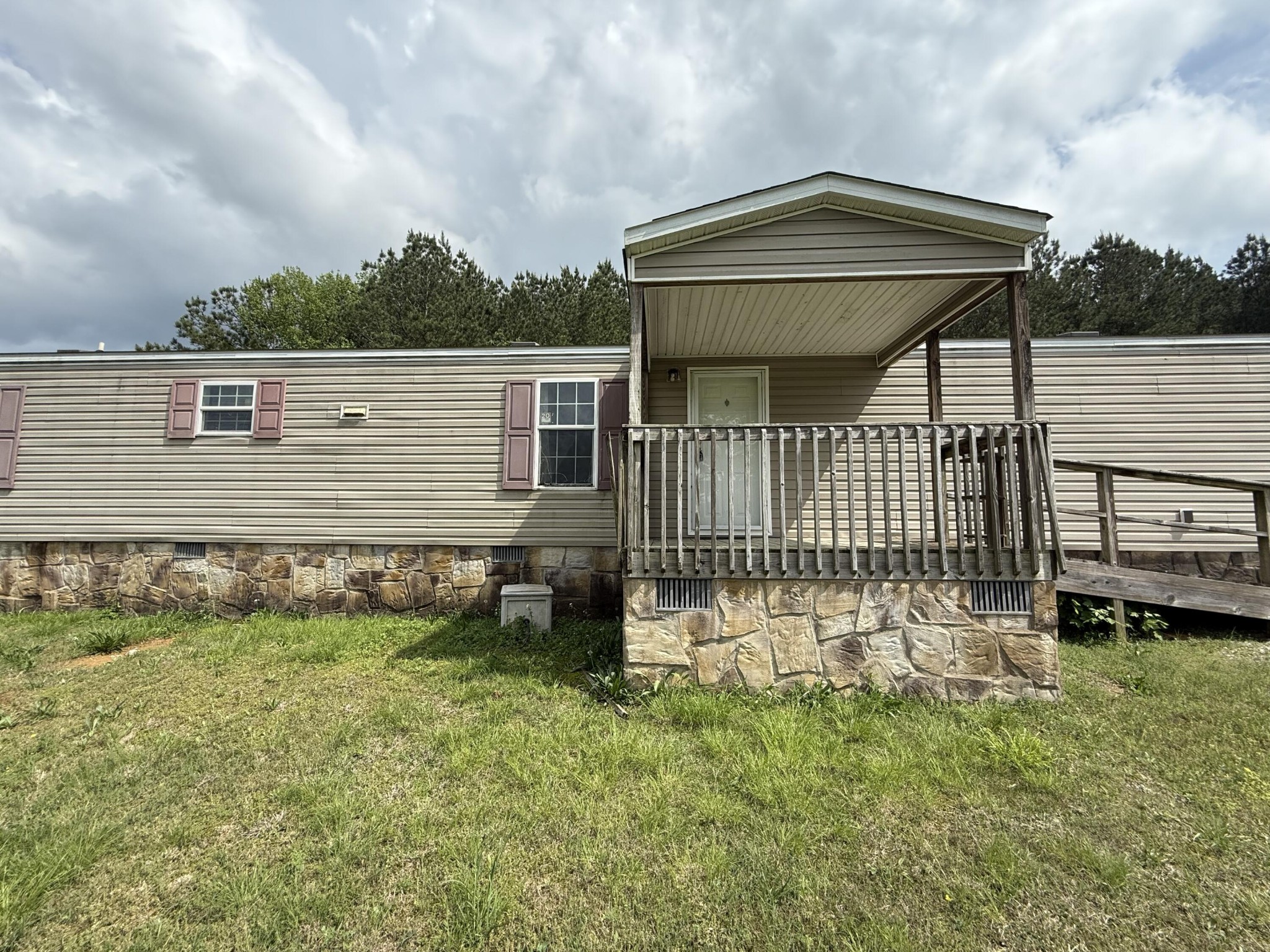 1001 Old Three Notch Road Ringgold, GA 30736 - Photo 3 of 26 a front view of a house with a garden