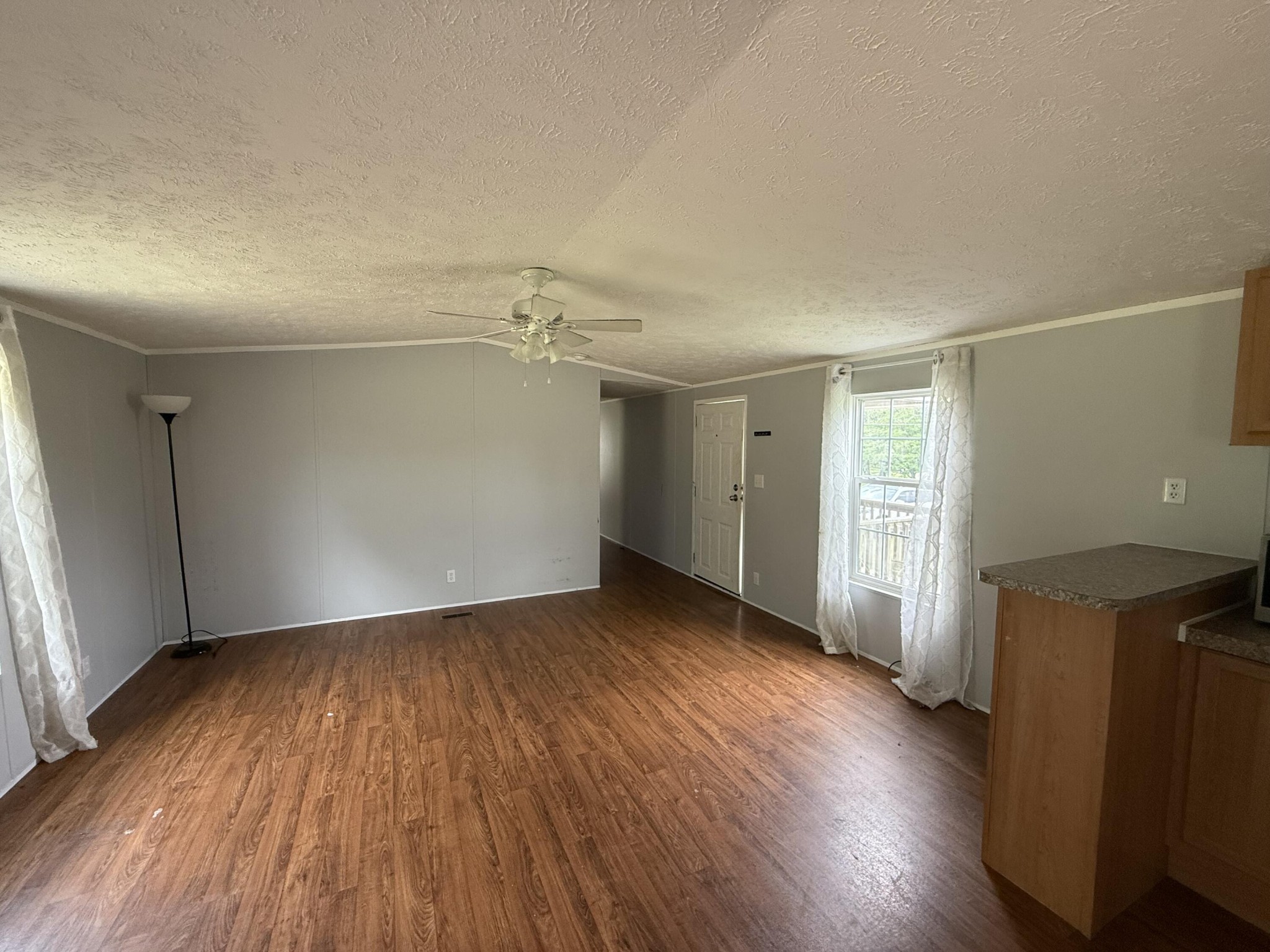 1001 Old Three Notch Road Ringgold, GA 30736 - Photo 5 of 26 an empty room with wooden floor and windows