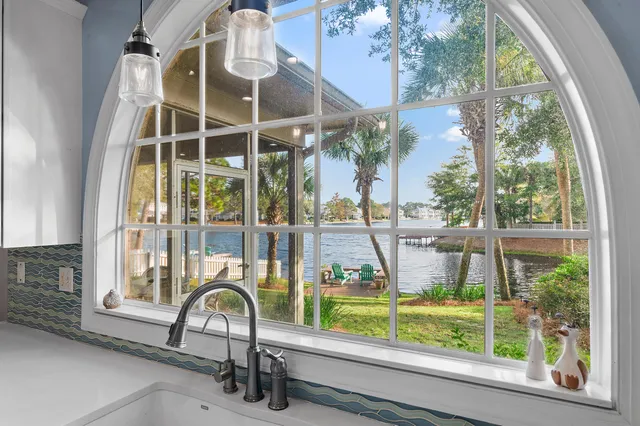 a outdoor space with furniture a fireplace and kitchen view