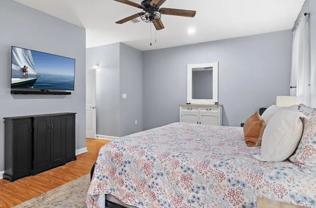 a bedroom with a bed and a table in it