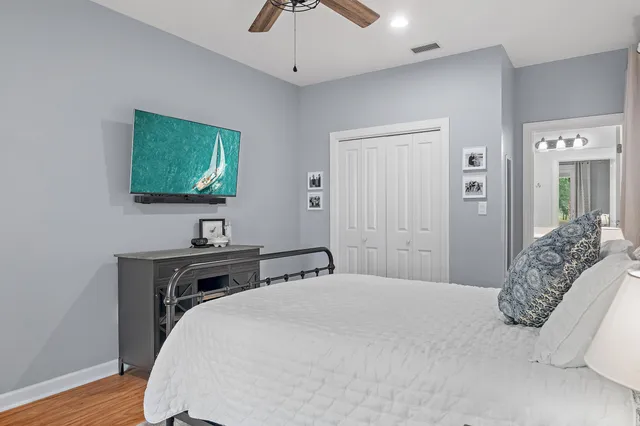 a bedroom with a bed and a table in it