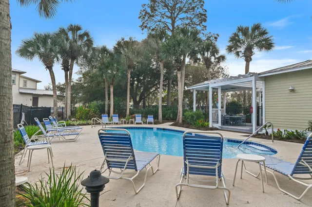 a view of a street with palm trees
