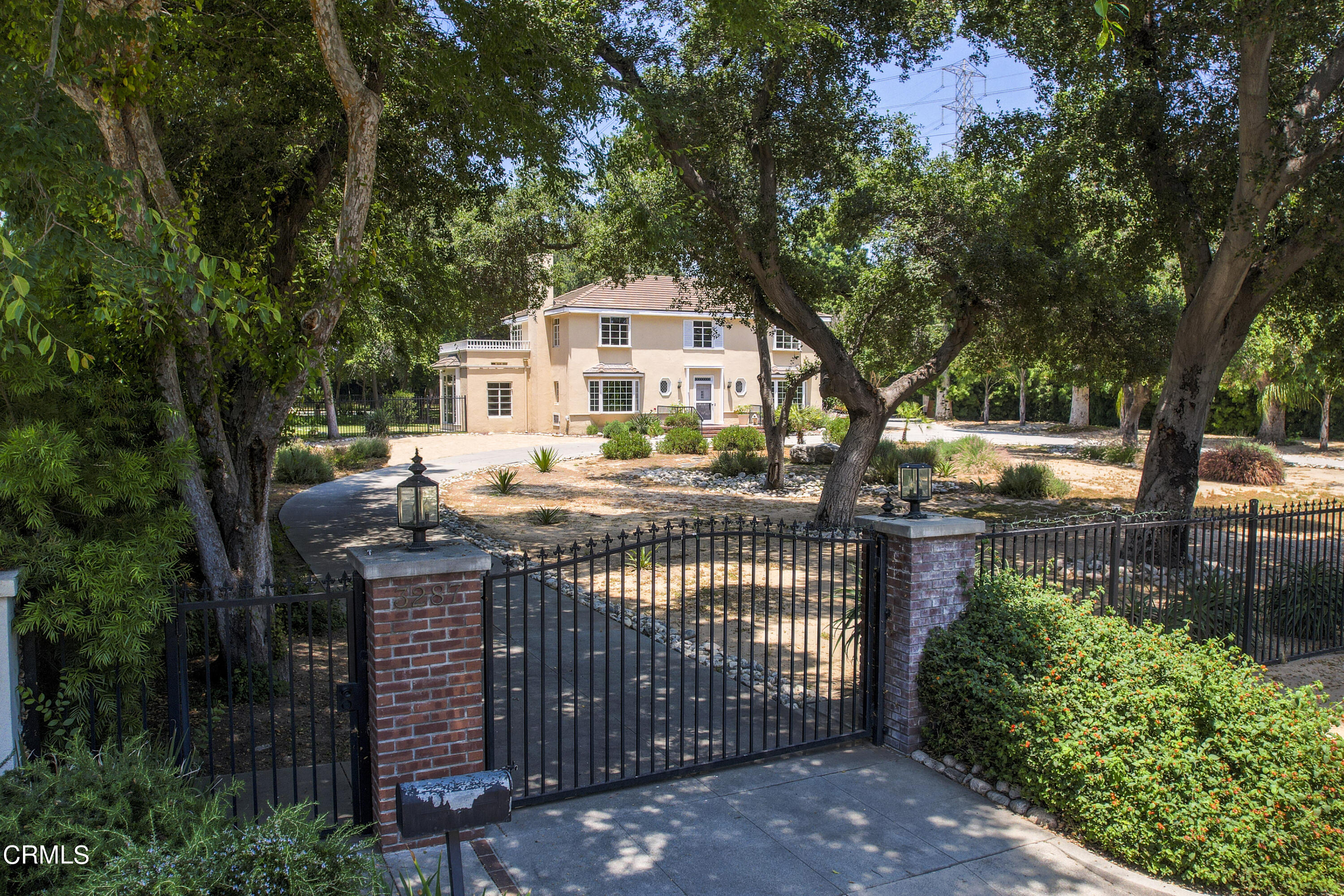 3287 Lombardy Road Pasadena, CA 91107 - Photo 1 of 59 a front view of a house with a garden