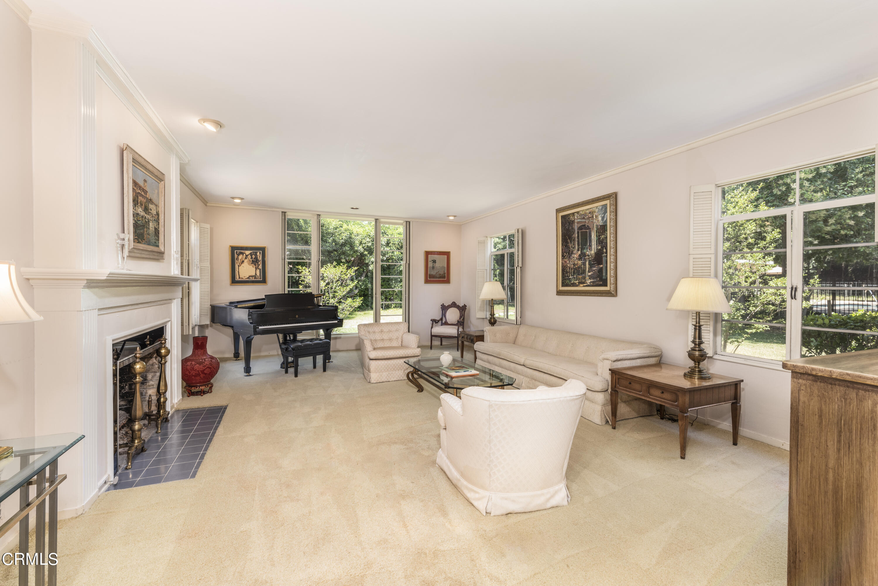 3287 Lombardy Road Pasadena, CA 91107 - Photo 13 of 59 a living room with furniture a fireplace and a large window