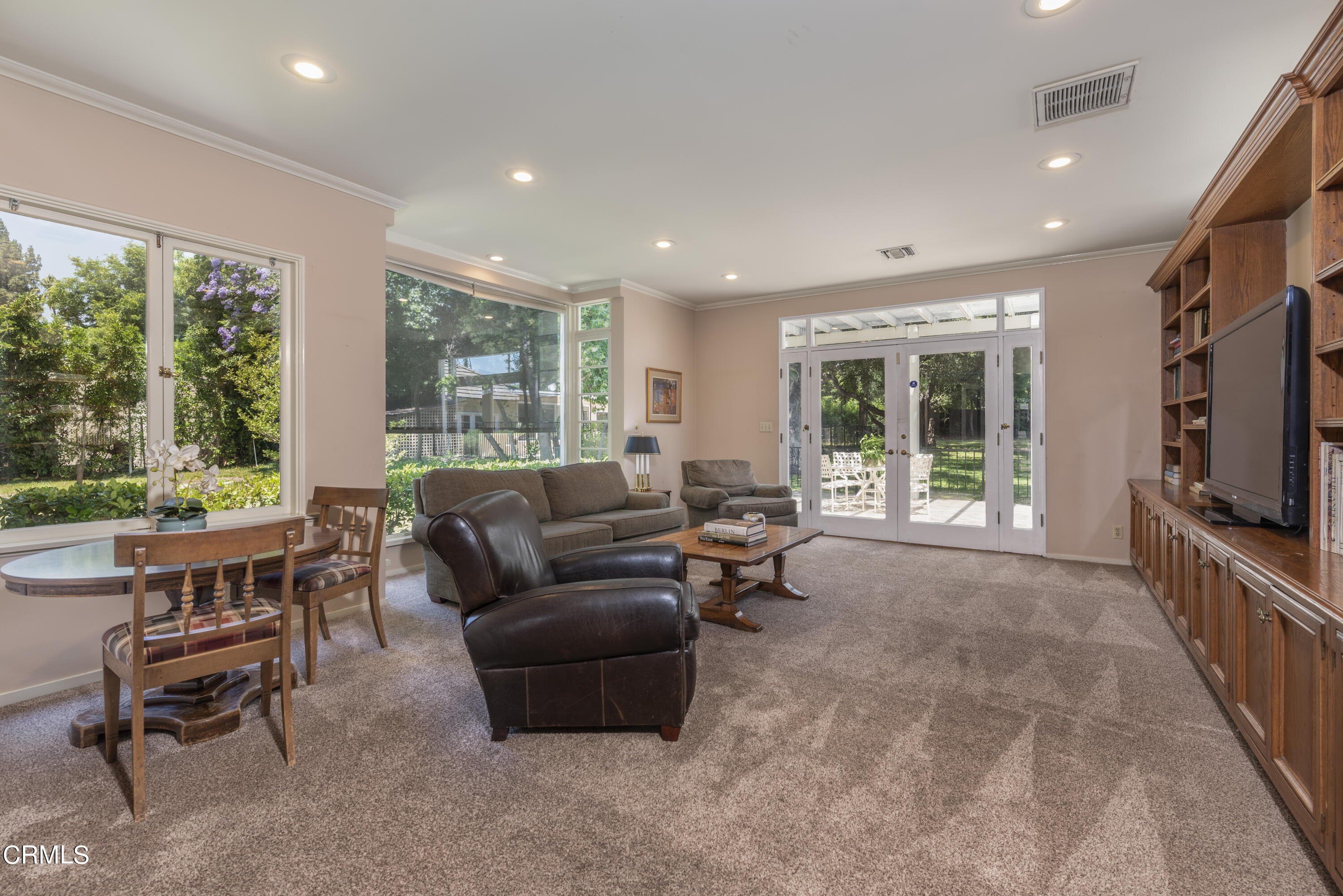 3287 Lombardy Road Pasadena, CA 91107 - Photo 23 of 59 a living room with furniture and a flat screen tv
