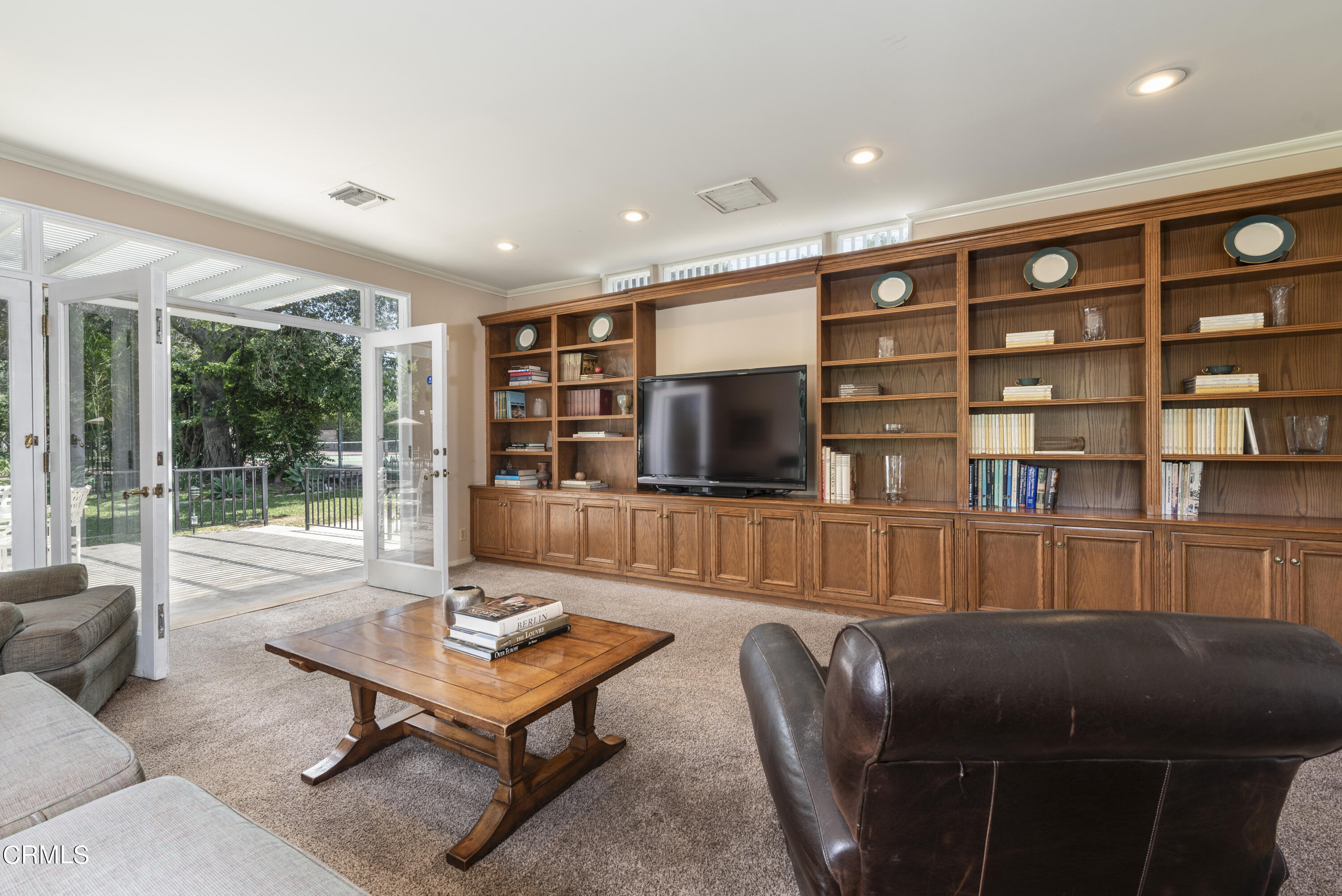 3287 Lombardy Road Pasadena, CA 91107 - Photo 24 of 59 a living room with furniture and a flat screen tv