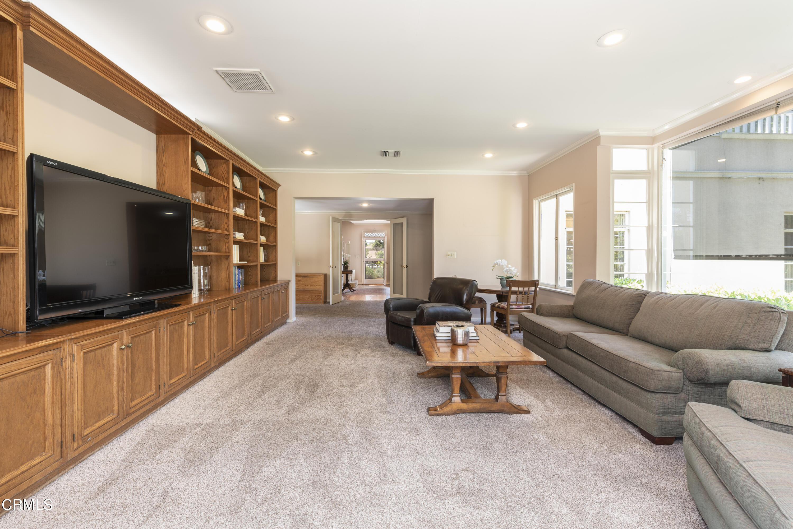 3287 Lombardy Road Pasadena, CA 91107 - Photo 25 of 59 a living room with furniture and a flat screen tv