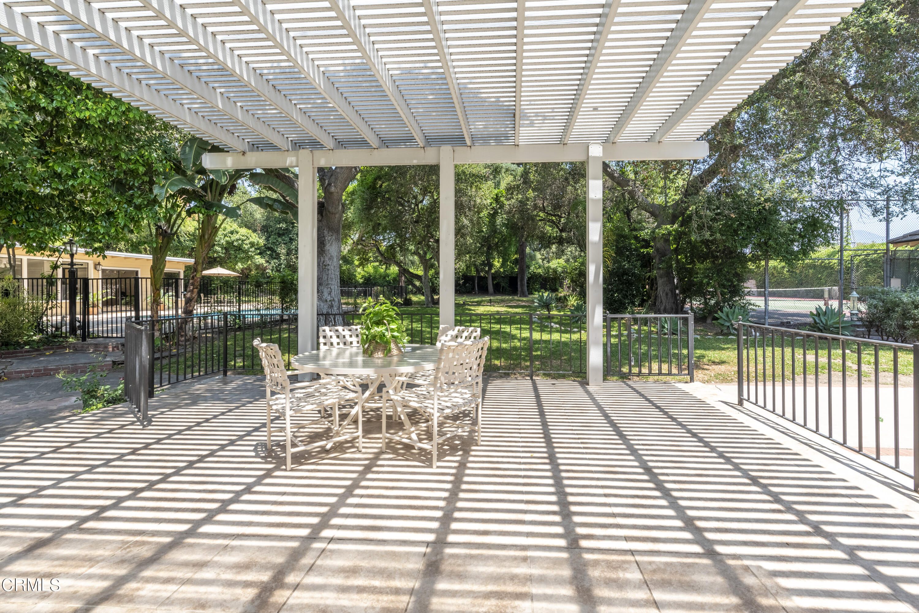 3287 Lombardy Road Pasadena, CA 91107 - Photo 26 of 59 a view of a patio with a table chairs and backyard