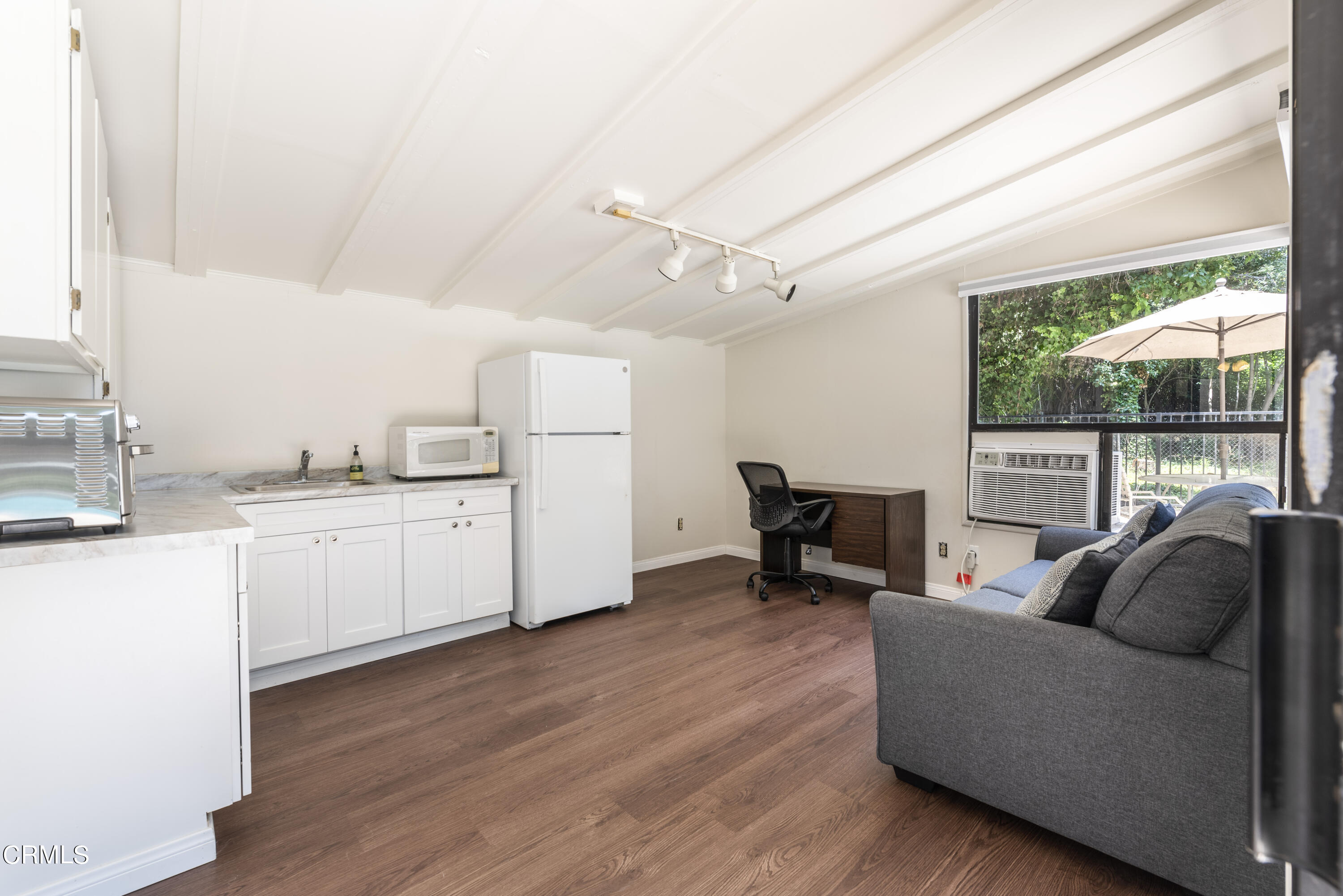3287 Lombardy Road Pasadena, CA 91107 - Photo 30 of 59 a living room with furniture and a large window