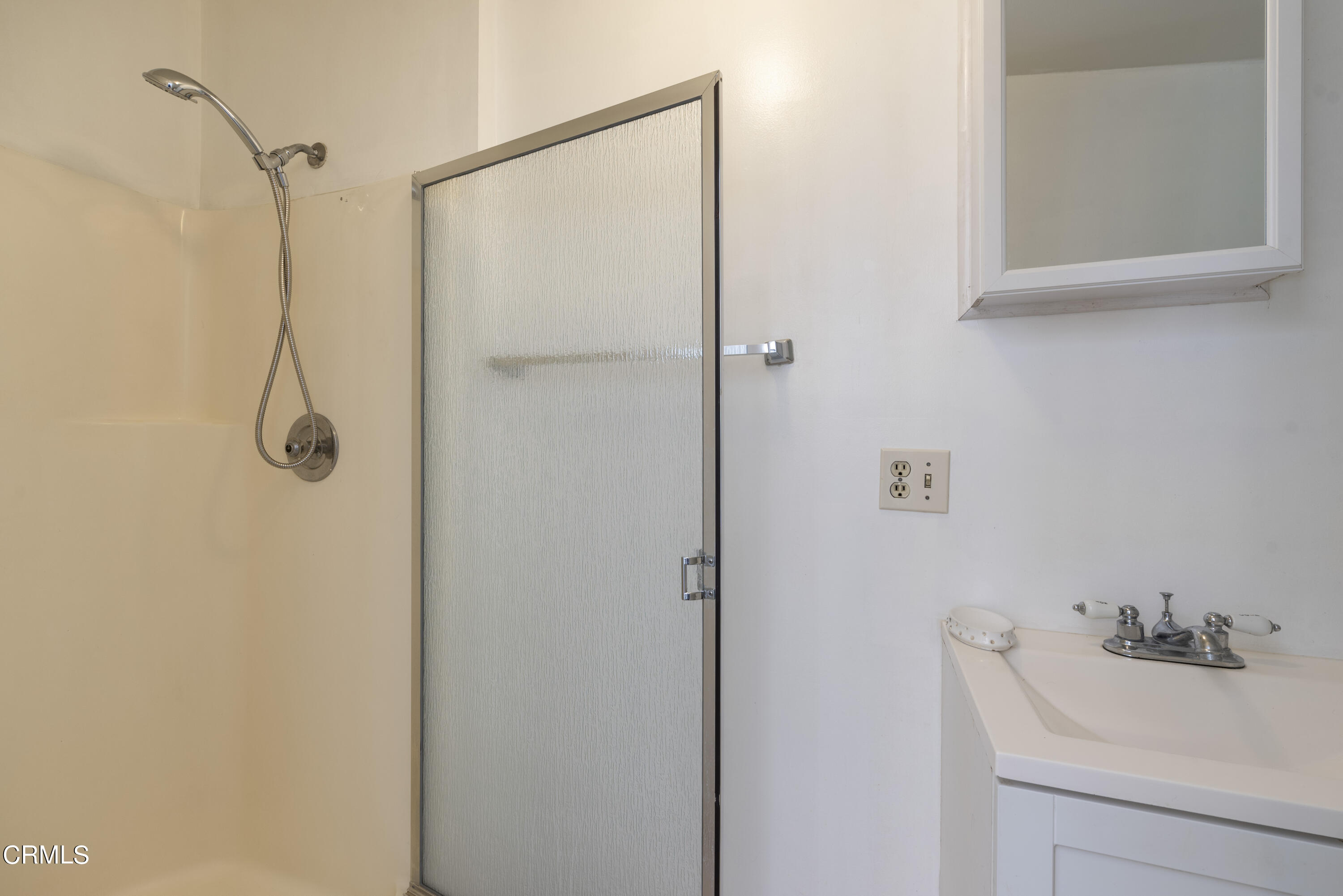 3287 Lombardy Road Pasadena, CA 91107 - Photo 32 of 59 a bathroom with a sink a mirror and shower