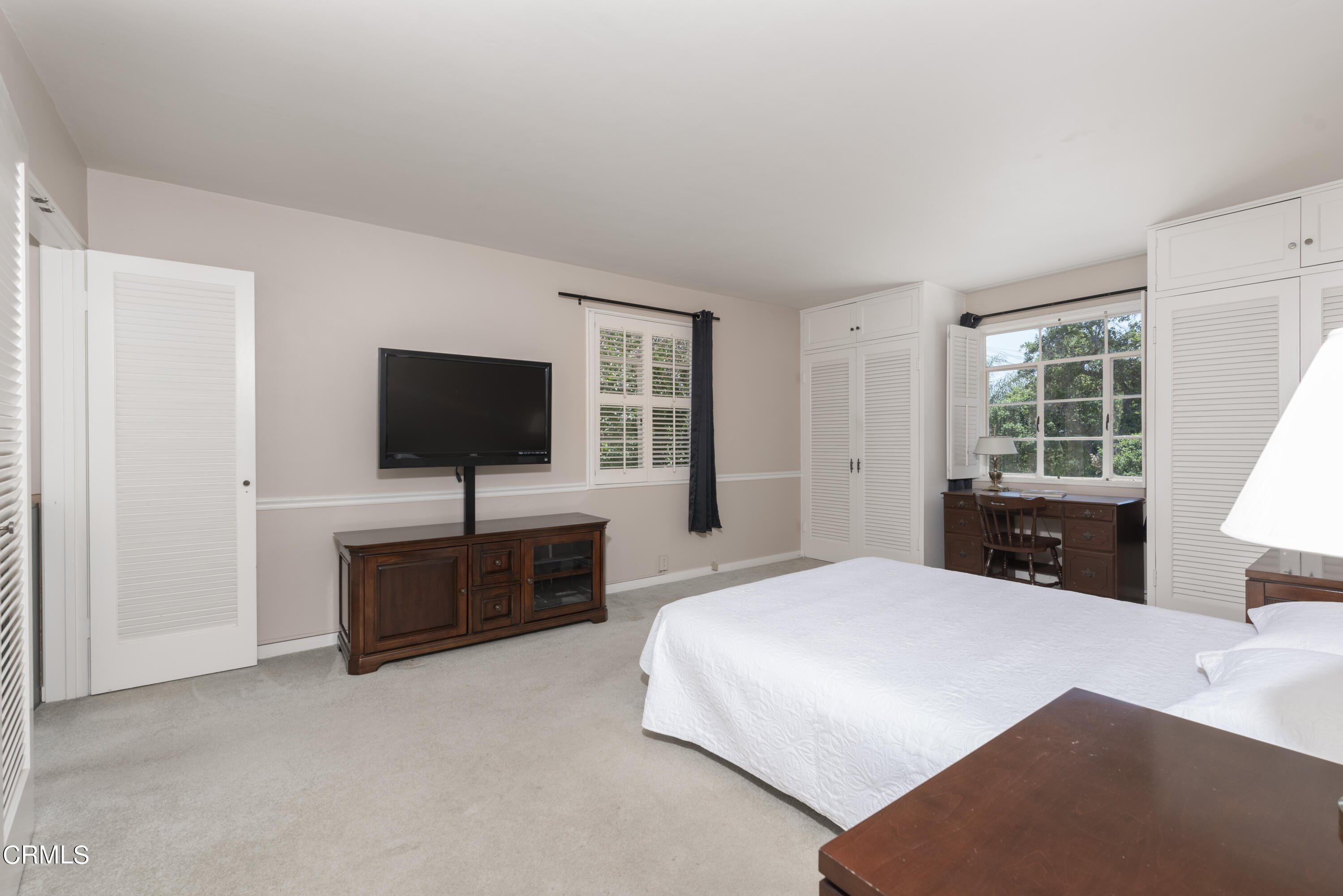 3287 Lombardy Road Pasadena, CA 91107 - Photo 41 of 59 a bedroom with a bed and a flat screen television