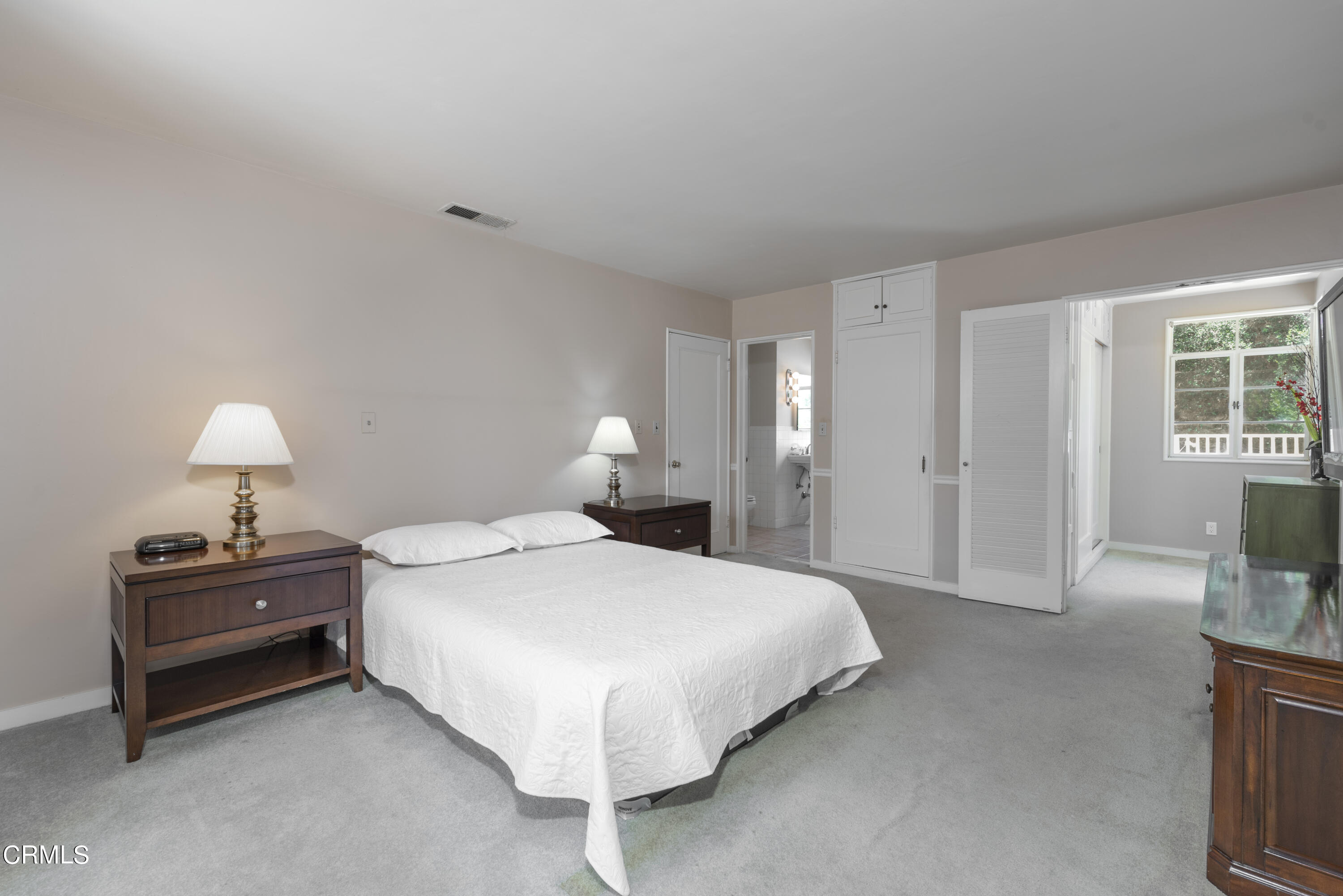 3287 Lombardy Road Pasadena, CA 91107 - Photo 43 of 59 a bedroom with a bed lamp closet and window