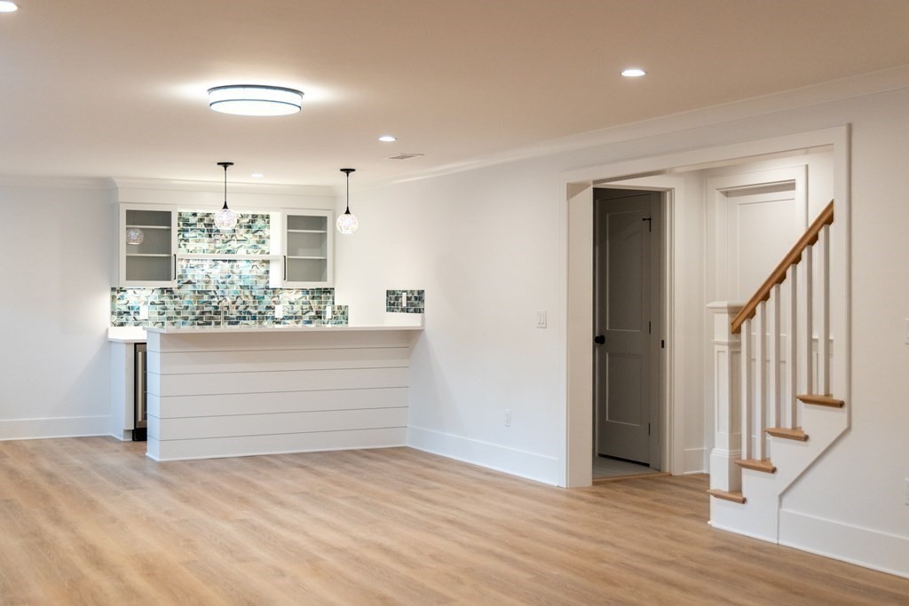 15 Woodside Road Framingham, MA 01701 - Photo 23 of 26 a view of room with wooden floor and staircase