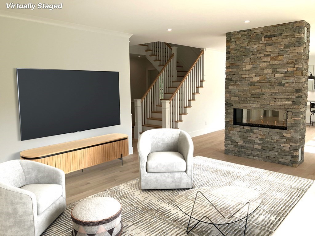 15 Woodside Road Framingham, MA 01701 - Photo 8 of 26 a living room with furniture and a flat screen tv
