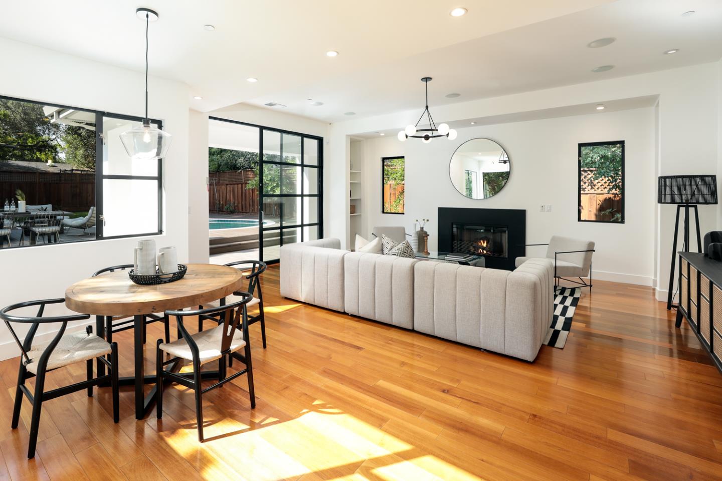 1136 Miramonte Avenue Los Altos, CA 94024 - Photo 11 of 58 a living room with furniture a fireplace and a flat screen tv