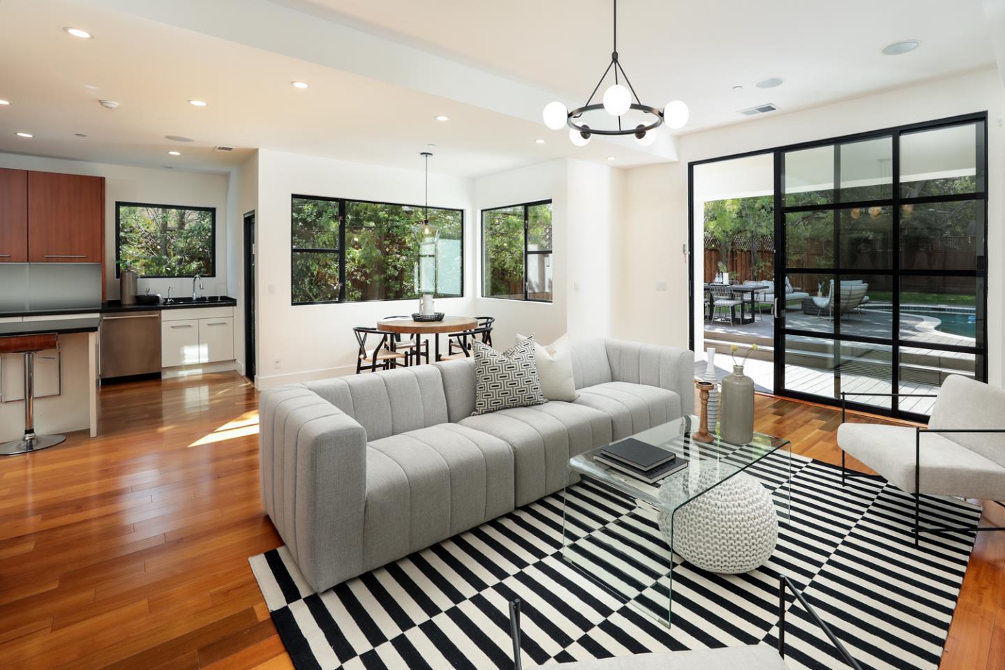 1136 Miramonte Avenue Los Altos, CA 94024 - Photo 16 of 58 a living room with furniture a large window and wooden floor