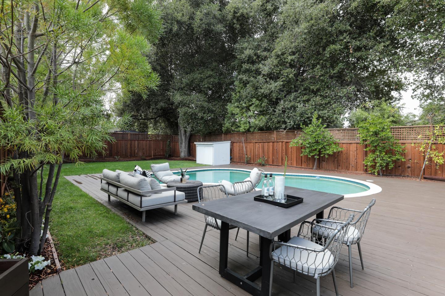 1136 Miramonte Avenue Los Altos, CA 94024 - Photo 18 of 58 a backyard of a house with table and chairs