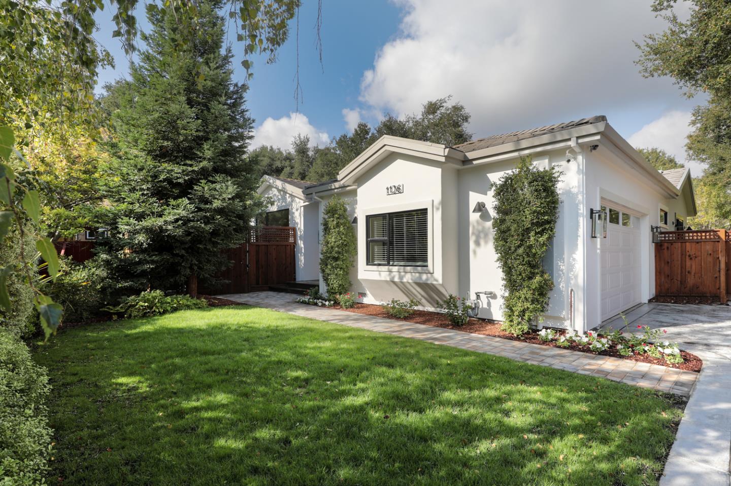 1136 Miramonte Avenue Los Altos, CA 94024 - Photo 2 of 58 a view of a backyard with plants and large tree