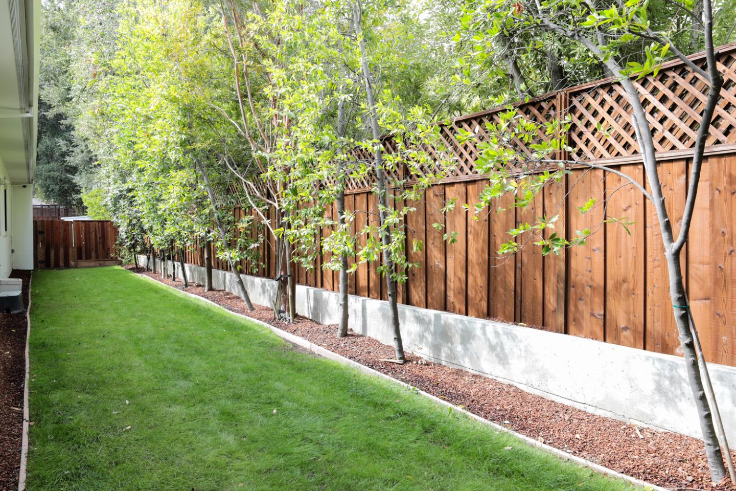 1136 Miramonte Avenue Los Altos, CA 94024 - Photo 21 of 58 a view of a backyard with wooden fence