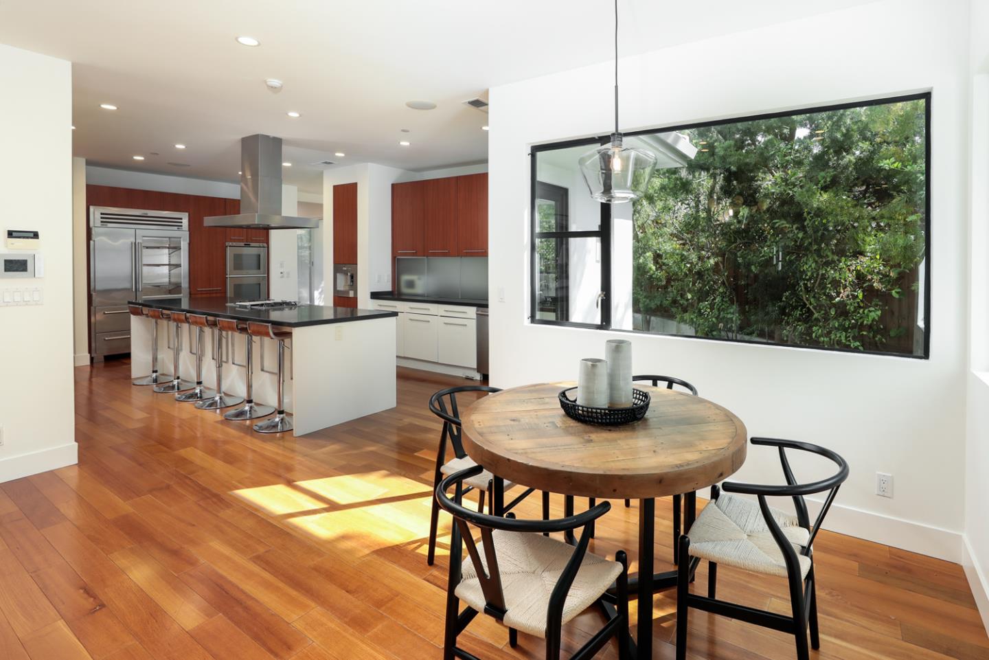 1136 Miramonte Avenue Los Altos, CA 94024 - Photo 45 of 58 a kitchen with a table and chairs in it