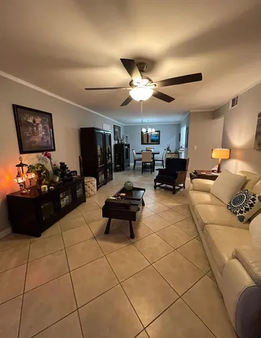 a kitchen with white cabinets and appliances