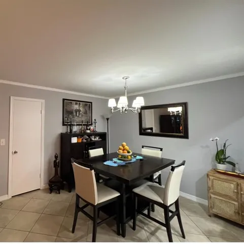 a kitchen with refrigerator and window