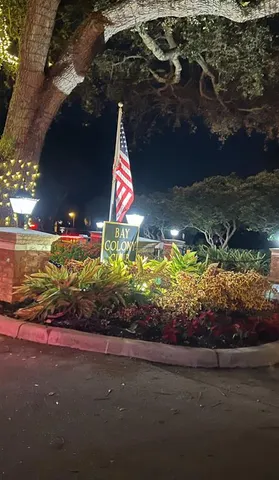 a view of a balcony with furniture and stove