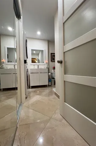 a bathroom with a toilet and a bath tub