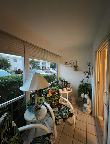 a front view of a house with sitting area