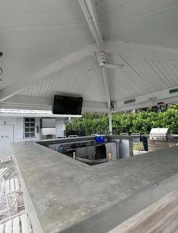 a view of a pool in the backyard of house