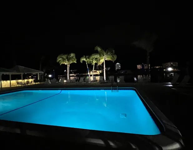 a room with lots of furniture and view of a projector