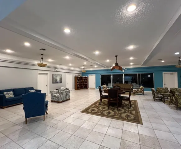 a view of a swimming pool with a patio