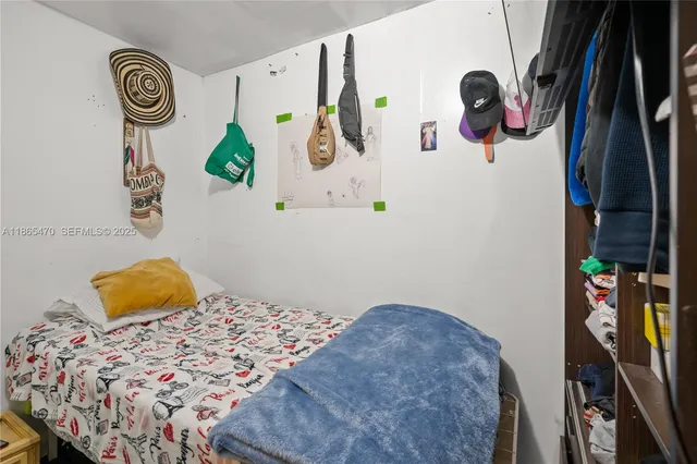 a bedroom with a bed and furniture