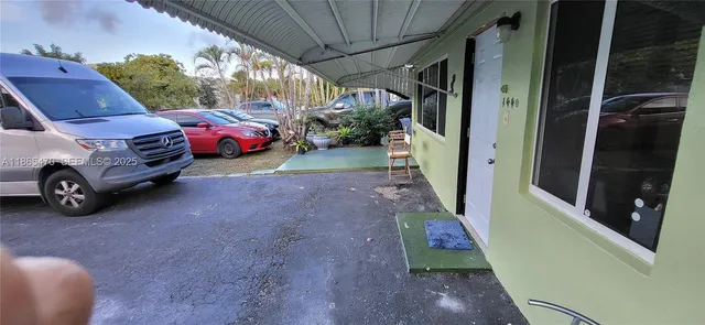 a living room with furniture kitchen and a table