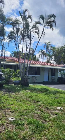 a view of cars parked in a yard