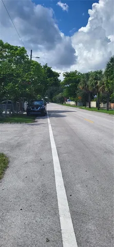 a yellow and red car parked in a garage