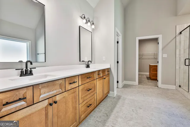 a bathroom with a bathtub and a shower