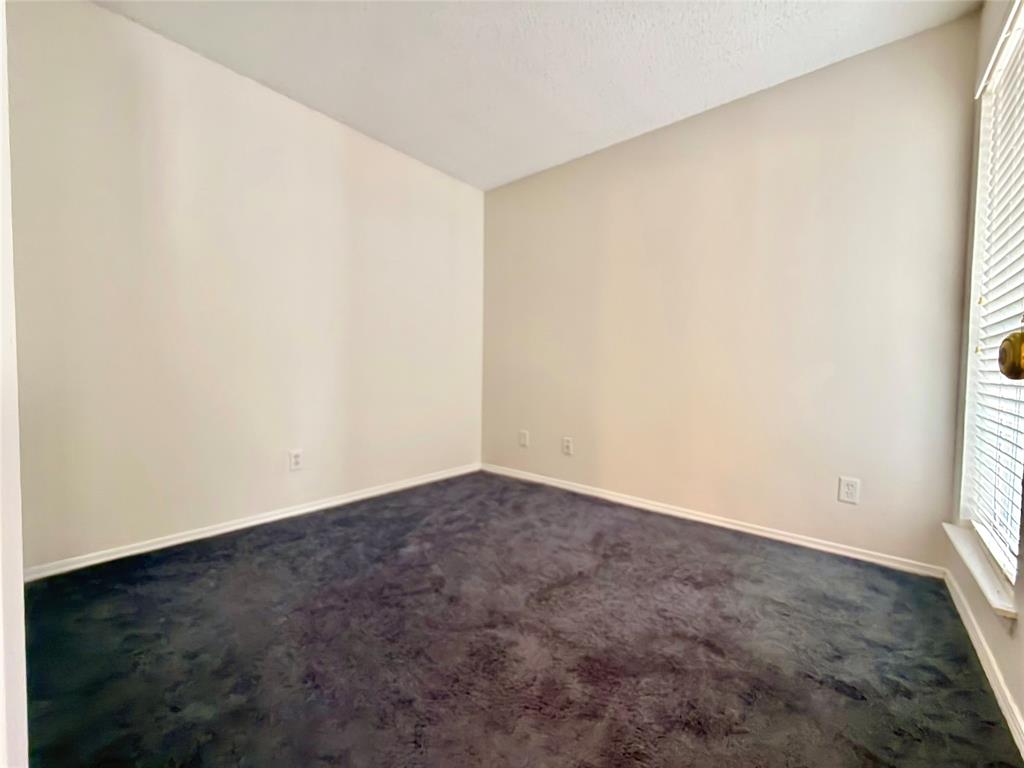 18333 Roehampton Drive, Unit 624 Dallas, TX 75252 - Photo 13 of 39 an empty room with a window