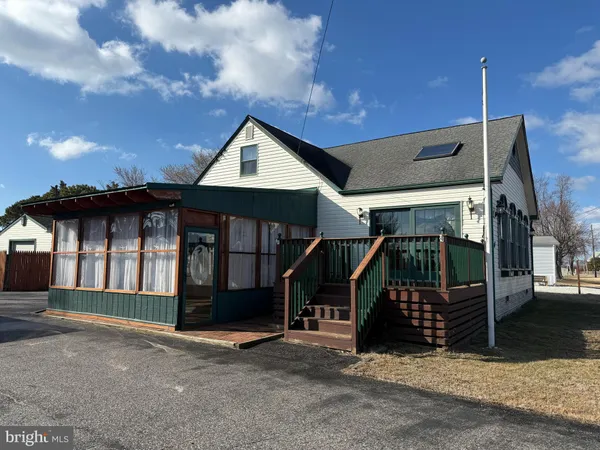 a front view of a house with garage