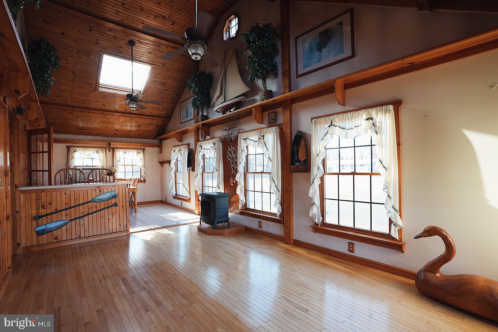7 Princeton Avenue Fortescue, NJ 08321 - Photo 13 of 79 a view of an empty room with window and wooden floor