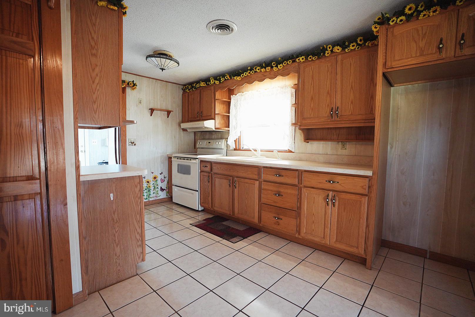 7 Princeton Avenue Fortescue, NJ 08321 - Photo 22 of 79 a kitchen with a sink window and cabinets